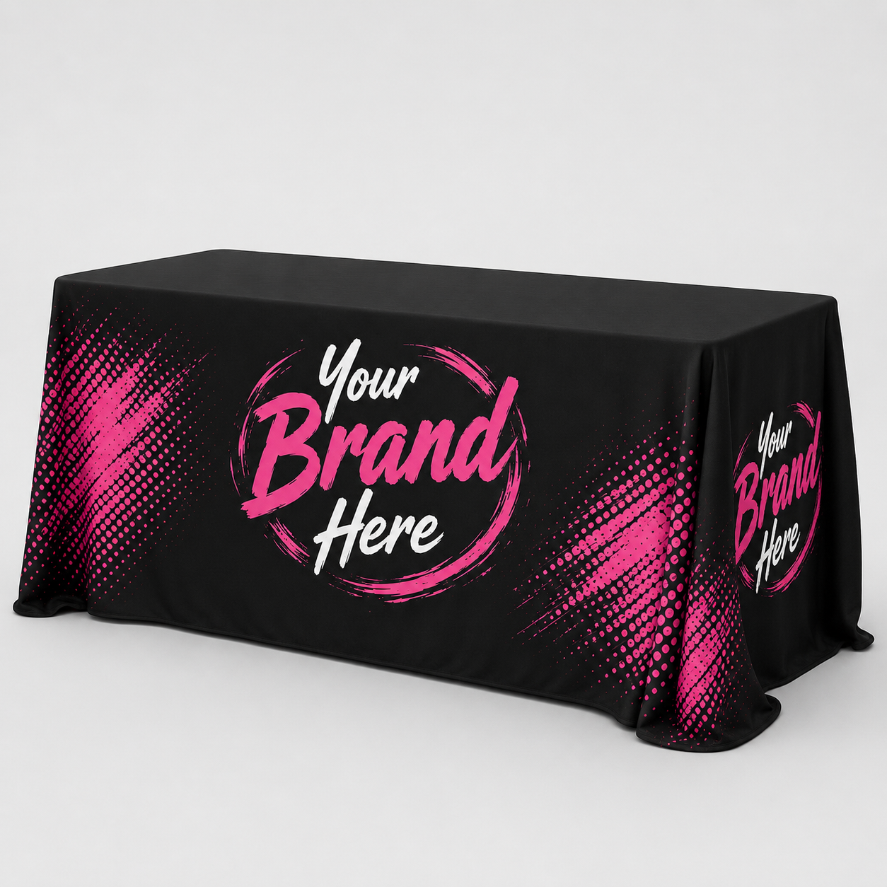 Black tablecloth with pink “Your Brand Here” logo on a draped display table.