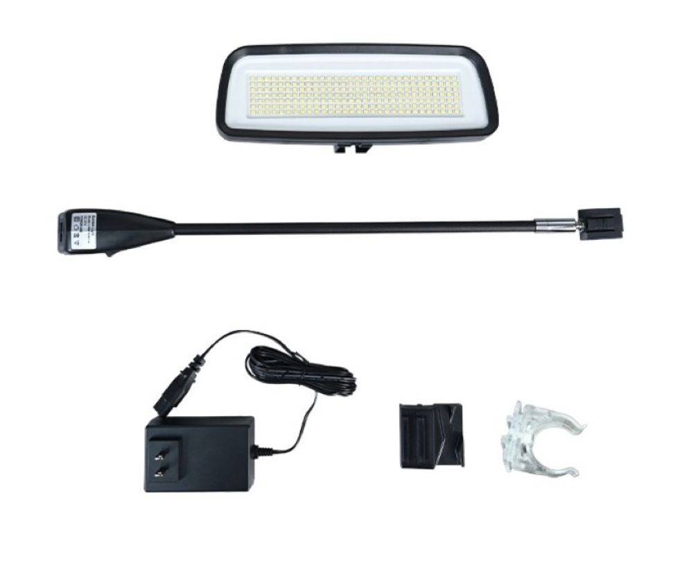 LED trailer light kit with rectangular light, wiring harness, power adapter, and mounting clips