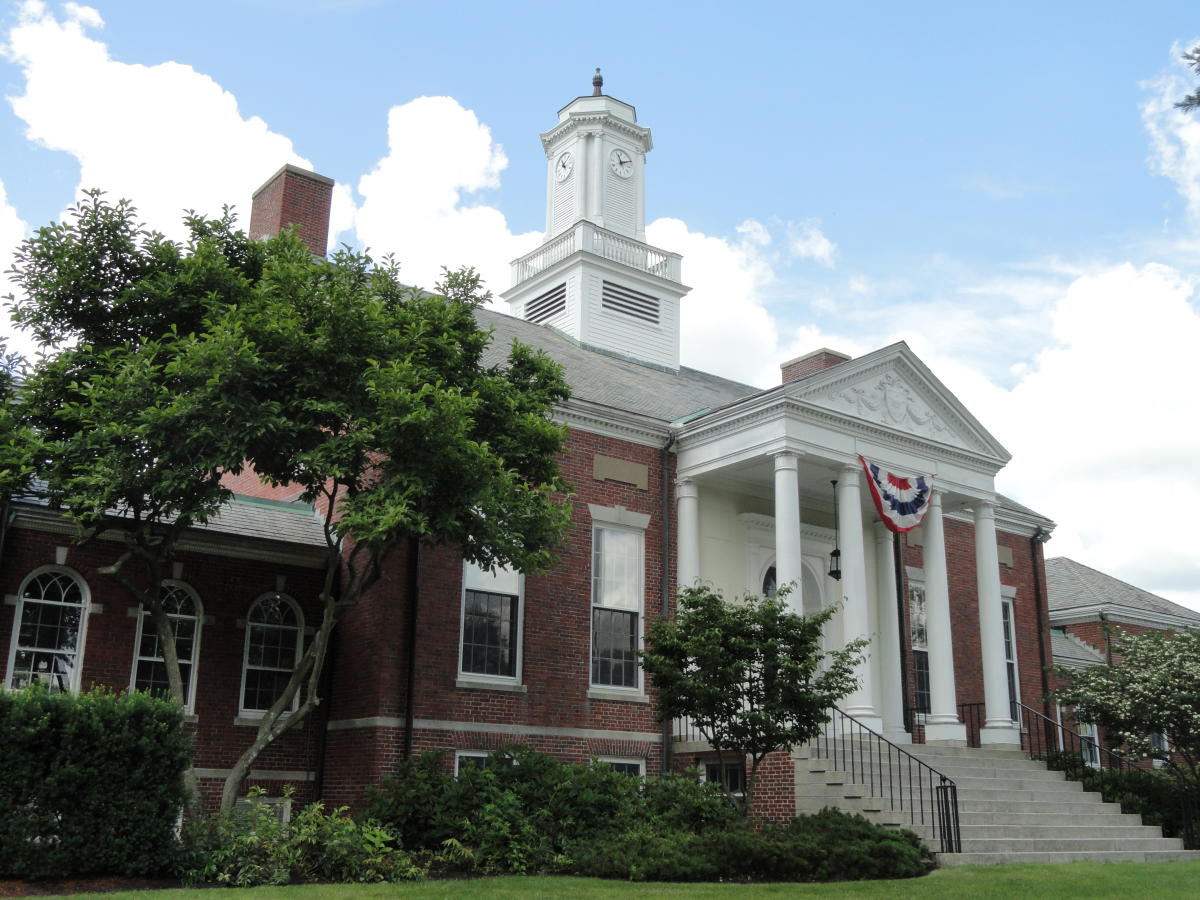 A large brick building with a clock tower on top of it