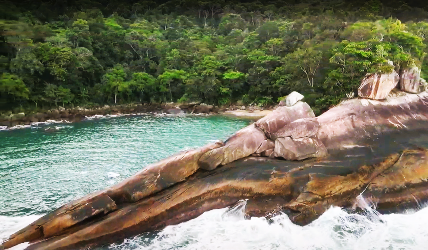 Natural rock formations shaping the calm waters of Caxadaço