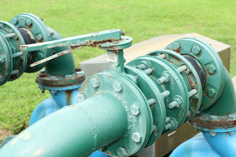 A Close Up of a Green Pipe With a Valve on It — Sweeney's Pumps & Irrigation In Port Stephens, NSW