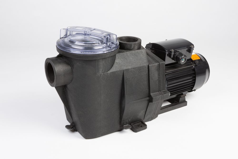 A Black Swimming Pool Pump is Sitting on a White Surface — Sweeney's Pumps & Irrigation In Medowie, NSW