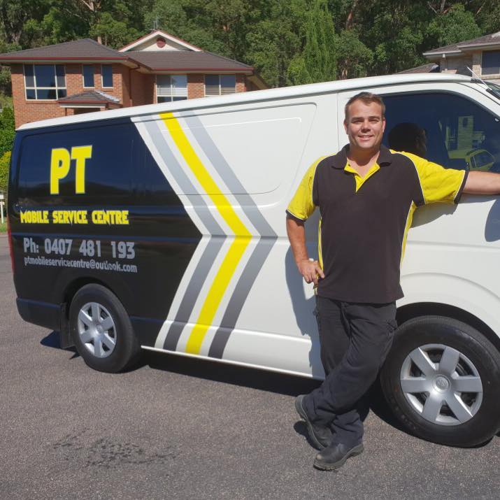 Professional Mobile Mechanic Standing On His Mobile Service - Mobile Mechanic In Newcastle