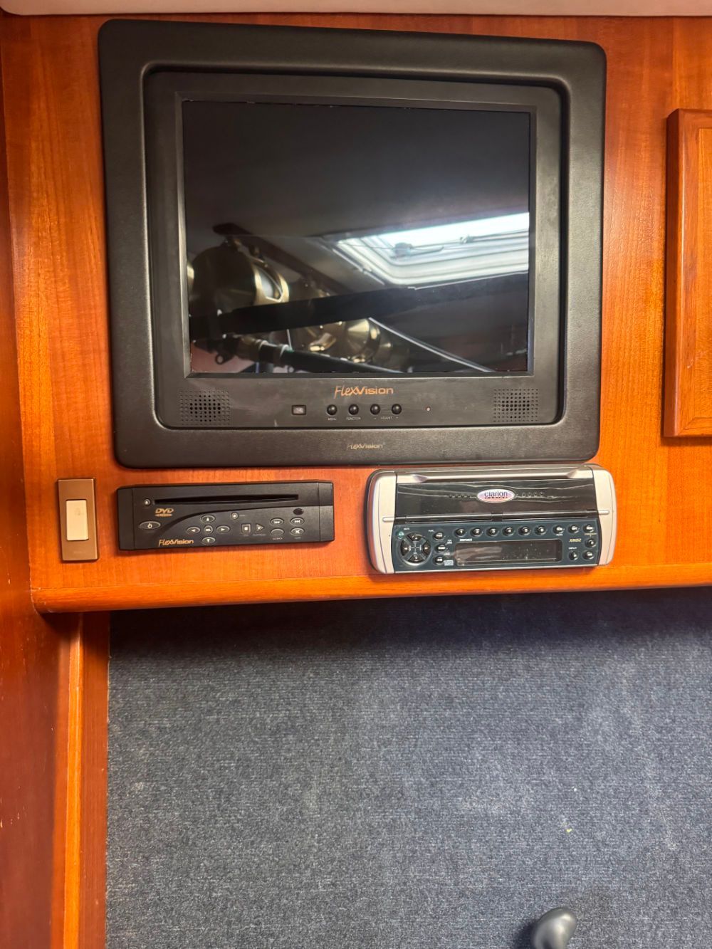 A television is mounted in the boat's cabin