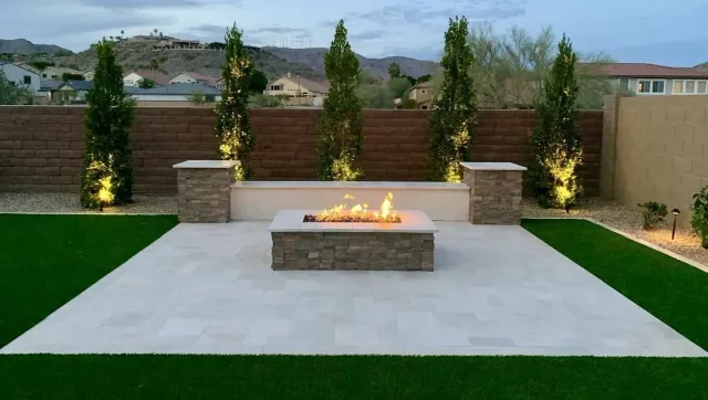 There is a fire pit in the middle of the lawn.