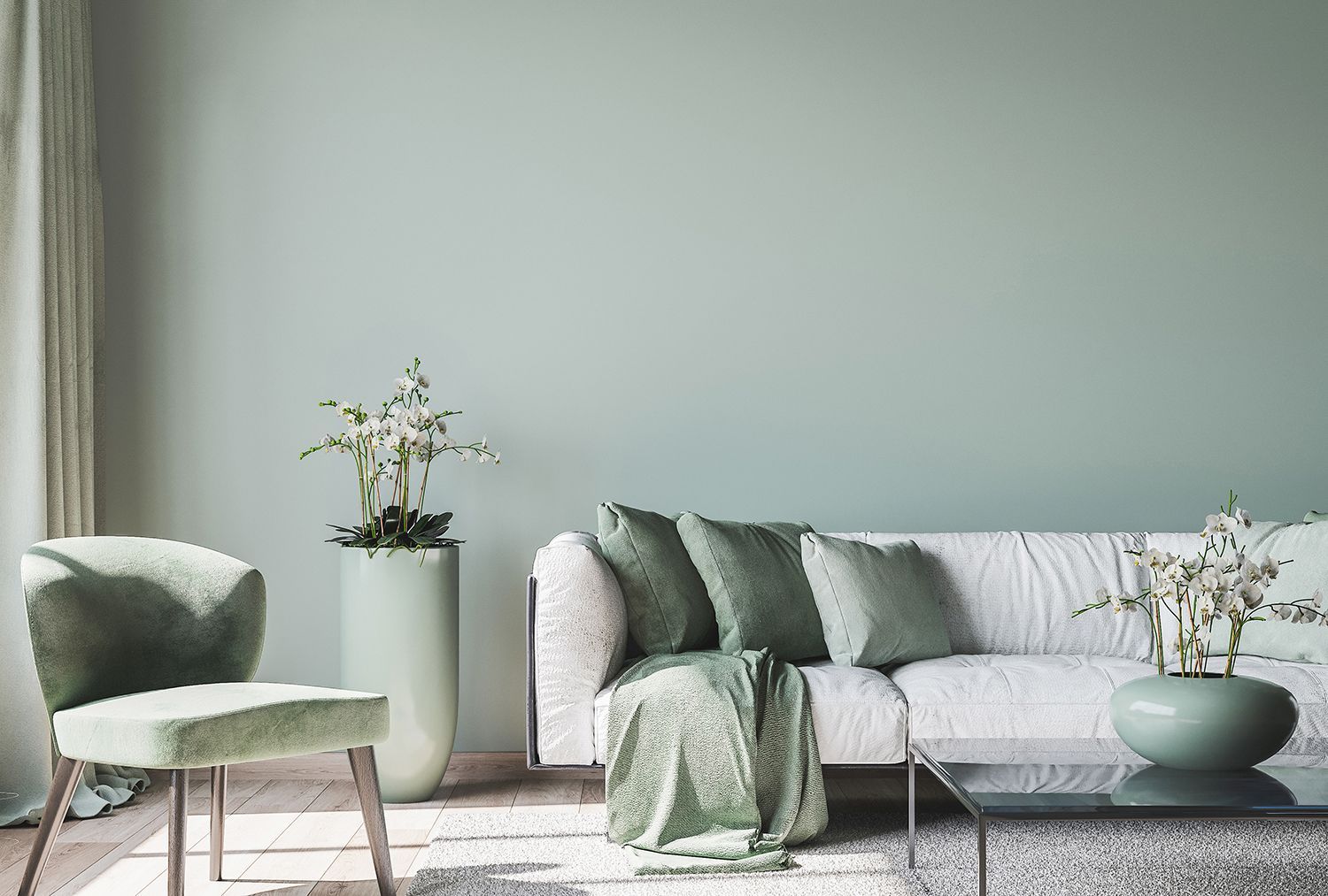 Soft minimalist living room with pale green and white furniture, potted plants, and a light gray wall. Soft minimalist living room with pale green and white furniture, potted plants, and a light gray wall.