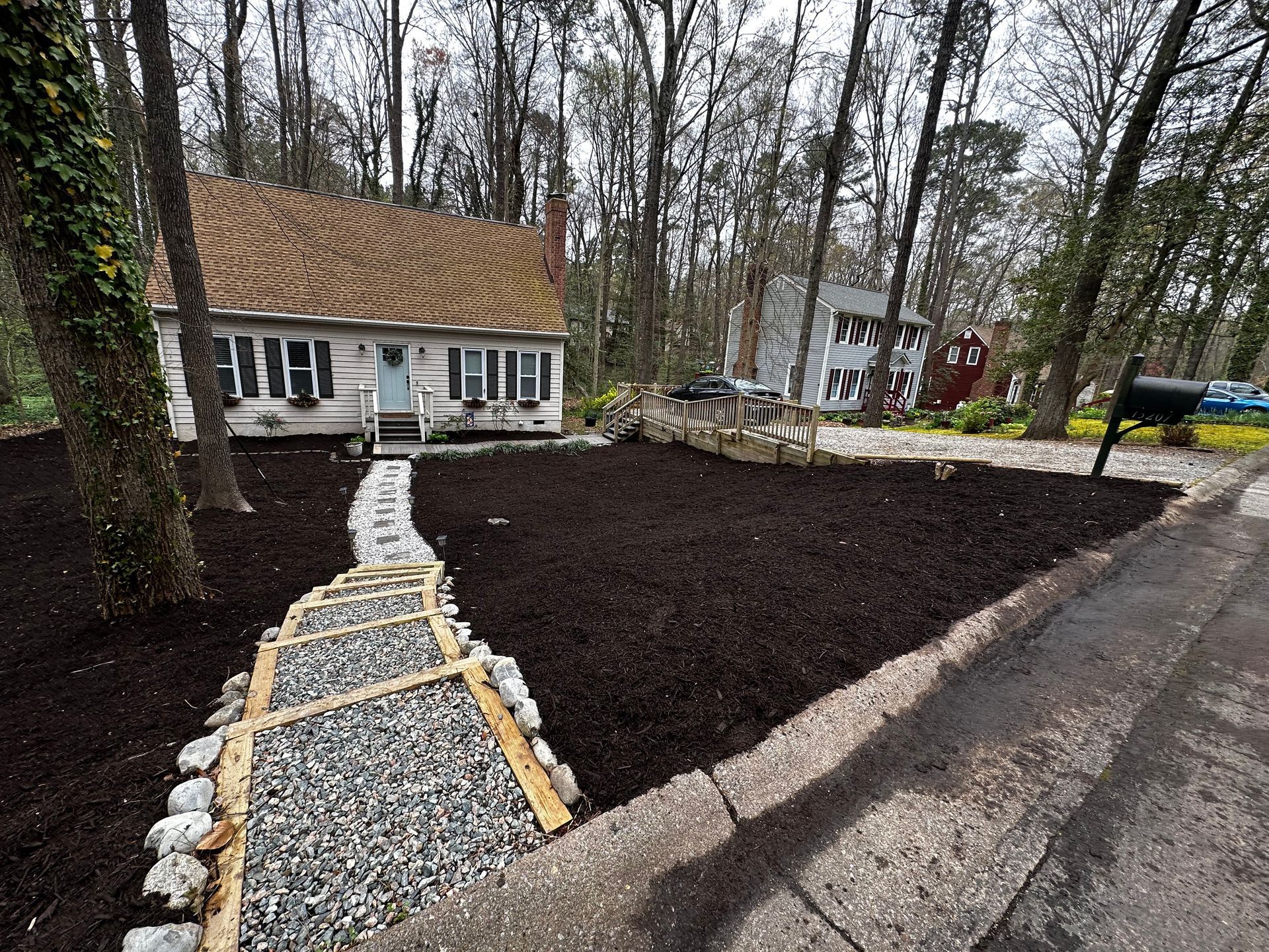 A house with a gravel walkway leading to it