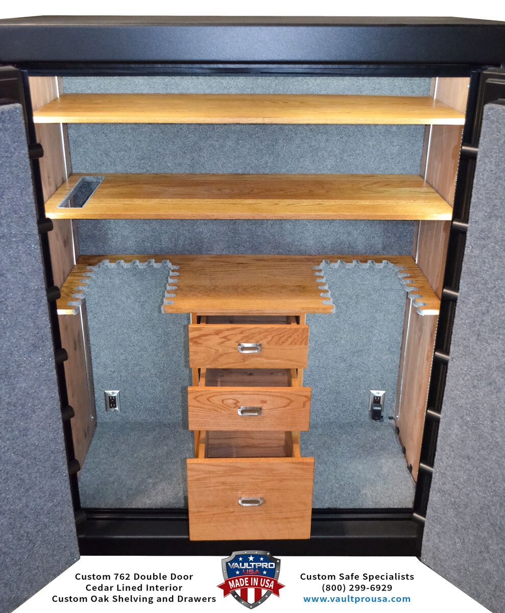 Custom large  double door model safe interior with cedar lined interior with custom oak drawers and shelving.