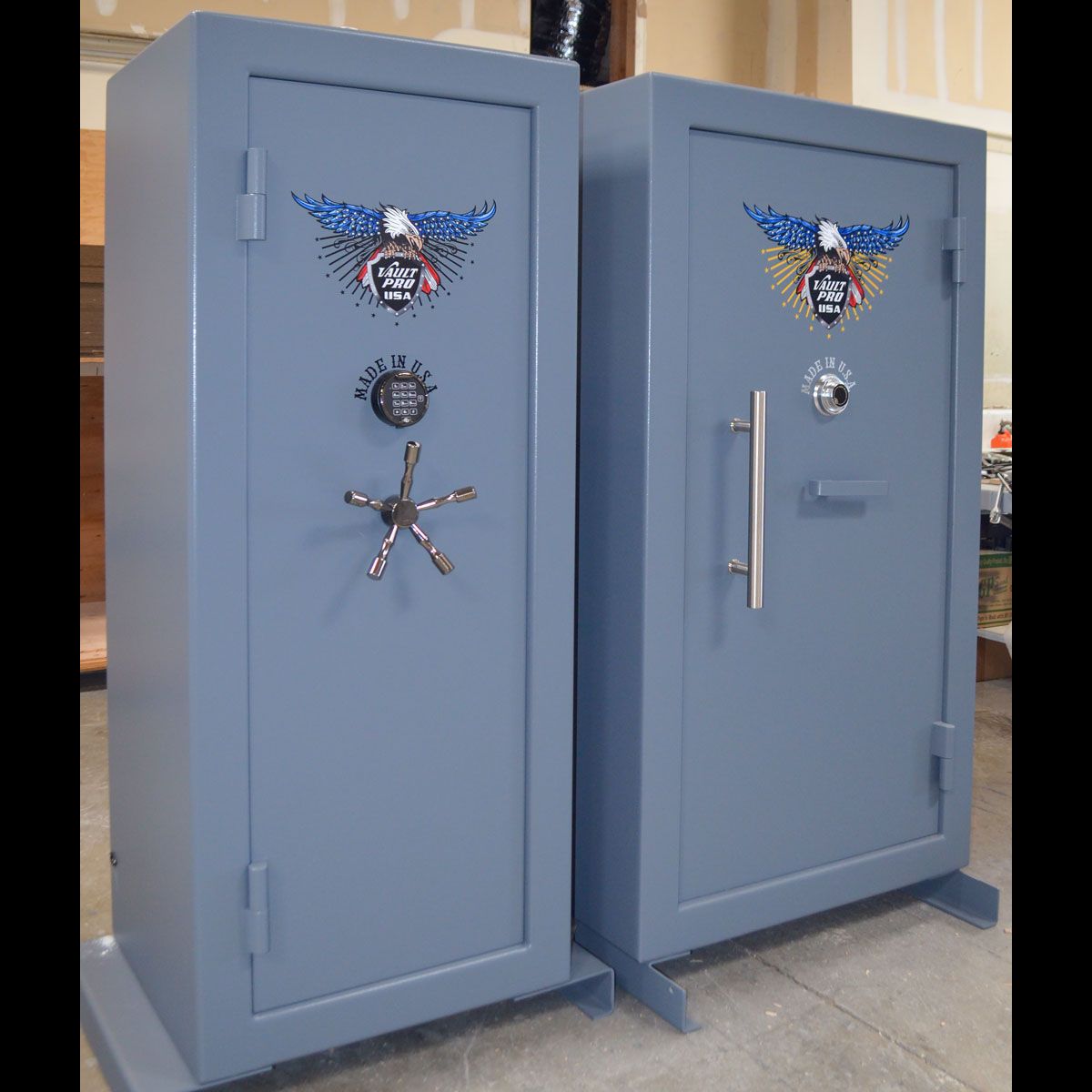 Two safes in gray finish. One with standard five prong bankers wheel, the other model is shown with optional pull handle and low profile L-shape handle.