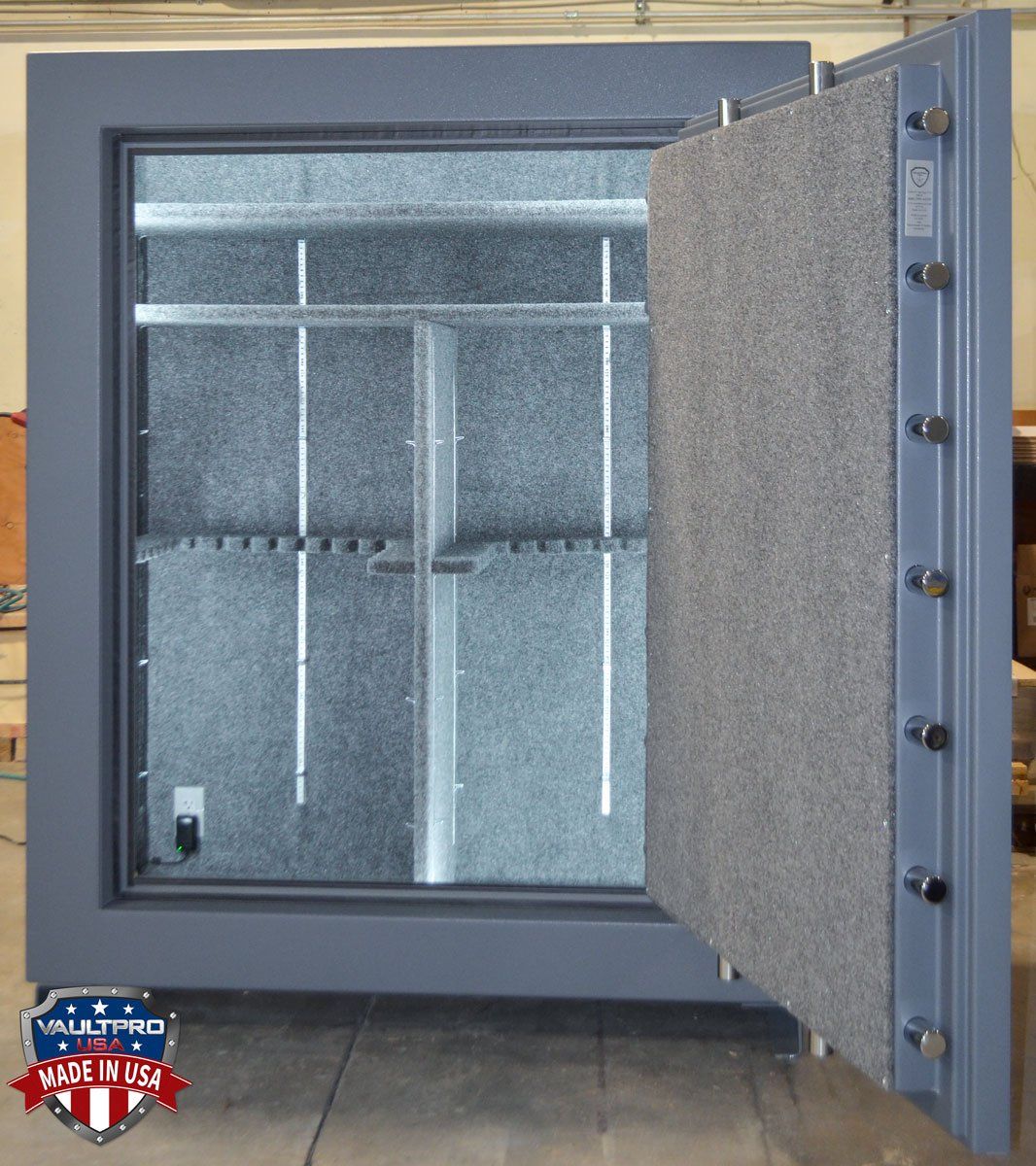 Open metal vault door revealing an empty gray insulated interior.