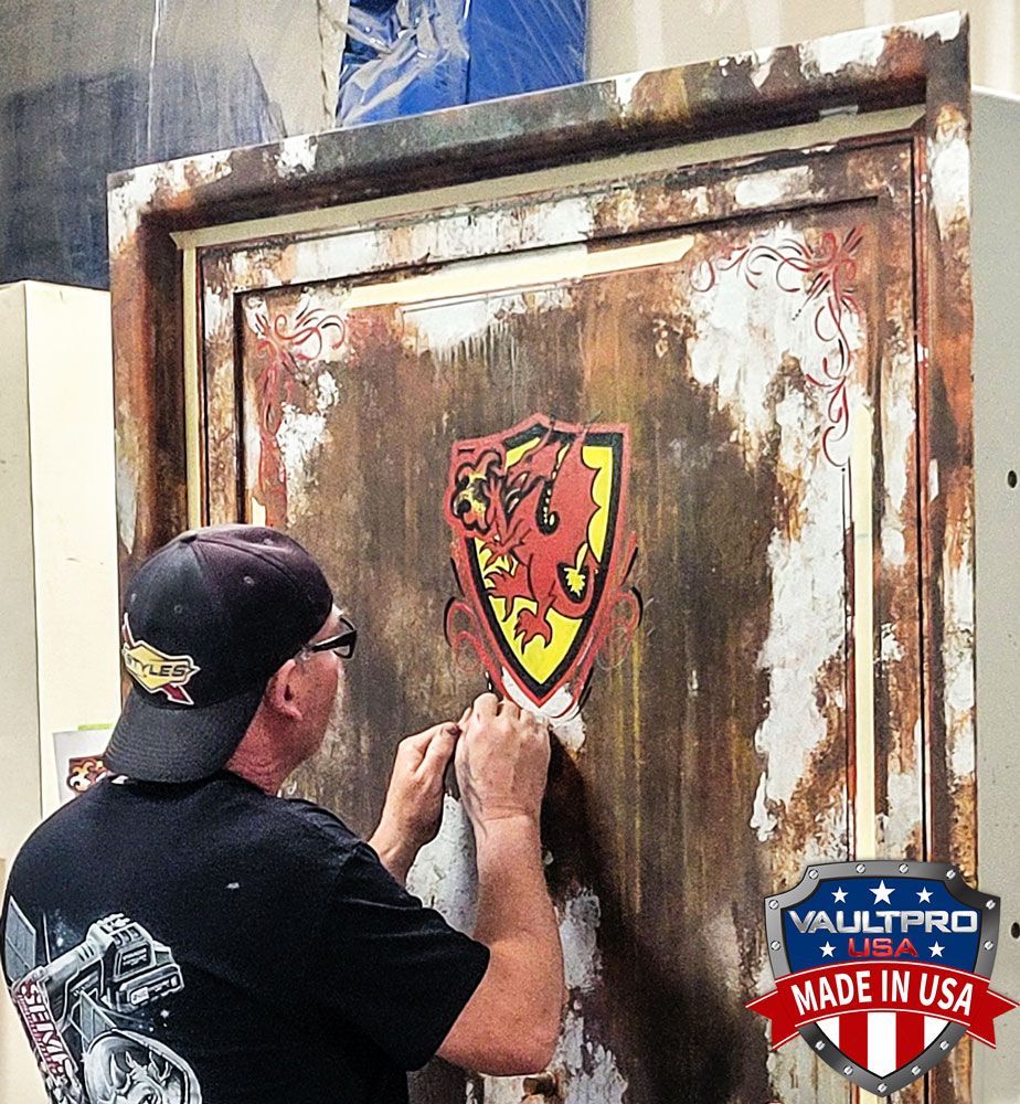 Person applying a red-and-yellow crest decal to a weathered metal door panel