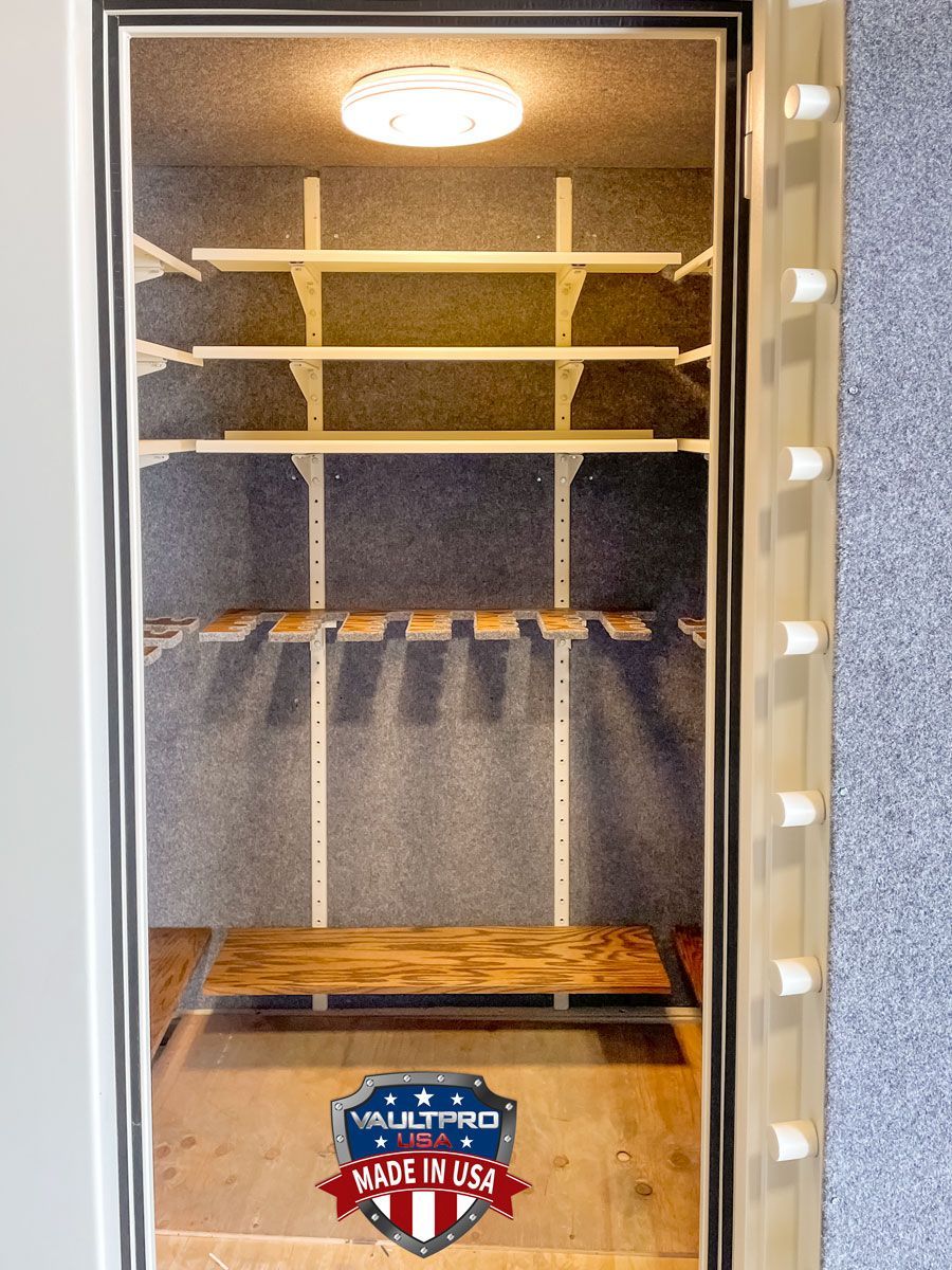 Custom long gun racks and shelves on back wall of walk-in-vault room.