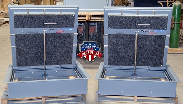 Two open gray display cases with dark interiors and red-white-blue emblem in the center.