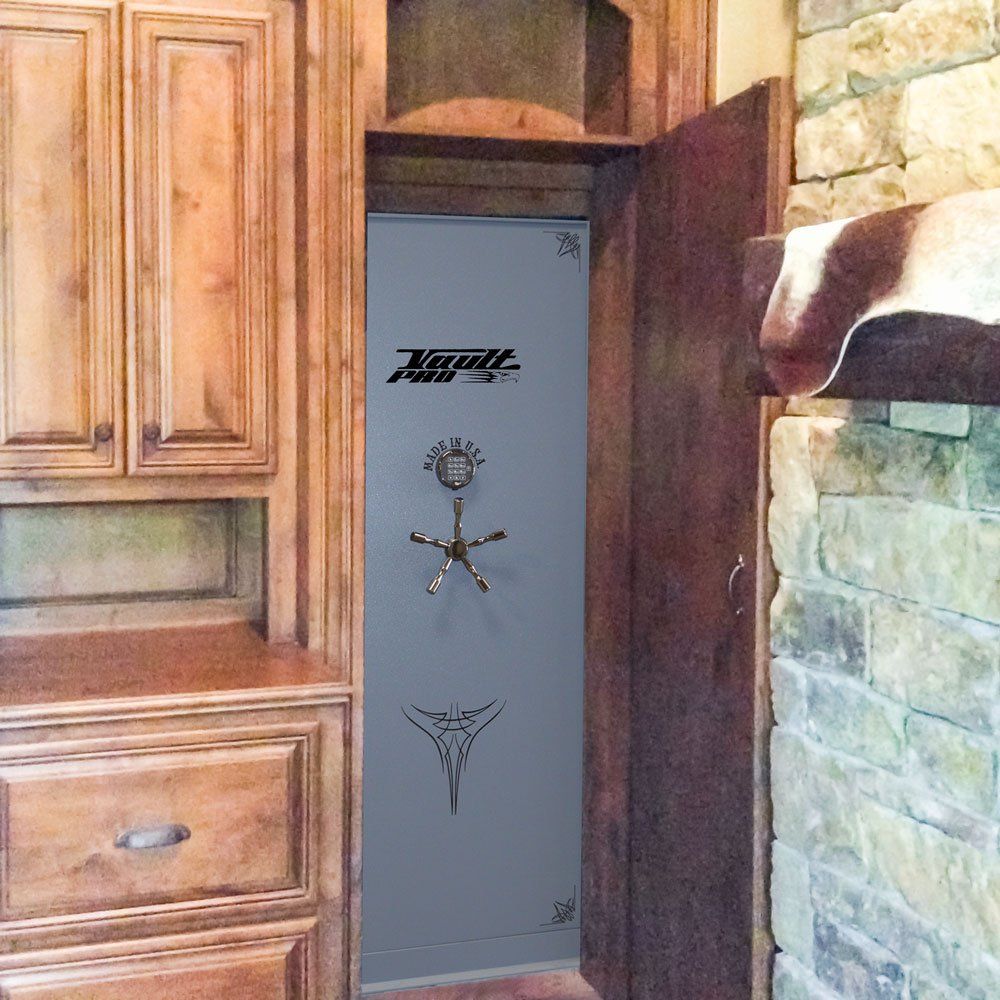 Gray gun safe hidden in a wooden cabinet beside a stone fireplace