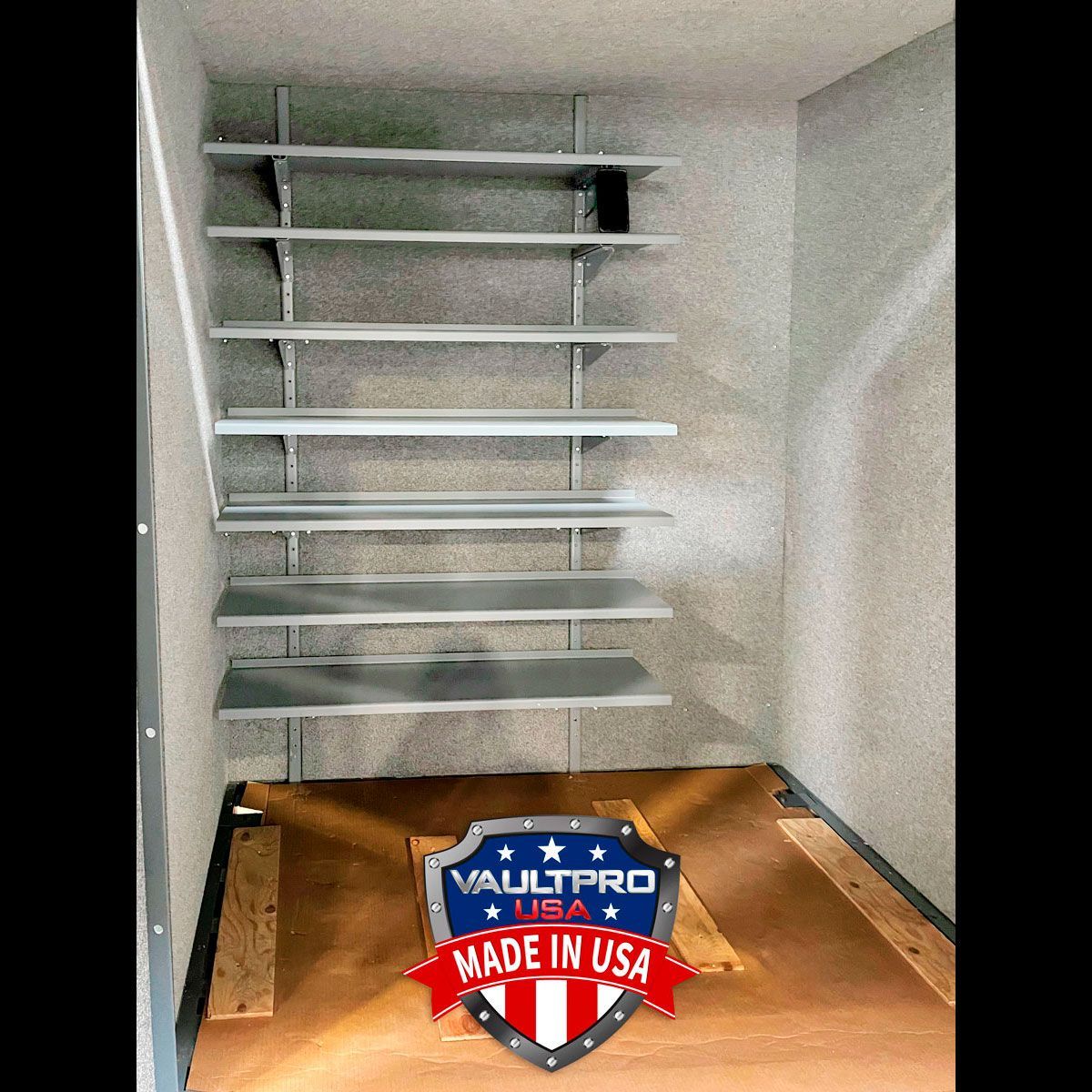 Empty white closet with shelves and a wooden floor, featuring a blue and red “Made in USA” badge.