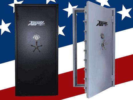 Two gun safes, one black and one open silver, with an American flag backdrop