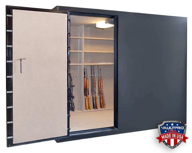 Open black gun safe with beige interior, shelves, and rifles stored inside