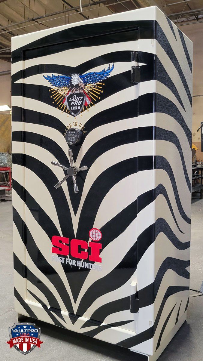 Zebra-striped cabinet with winged logo and red SC1 lettering on the front.
