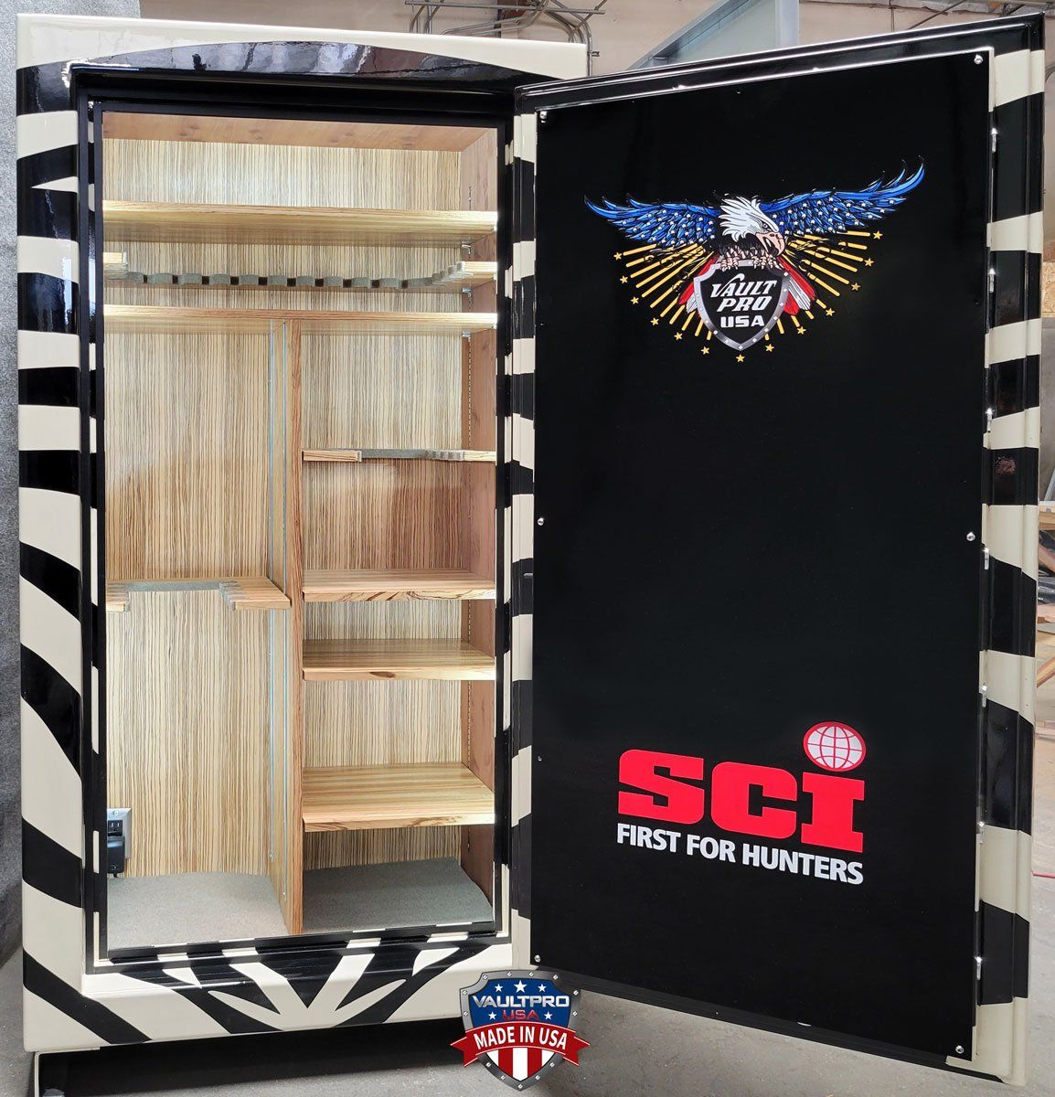 Open gun safe with shelves inside and black door featuring SCI First for Hunters logo.