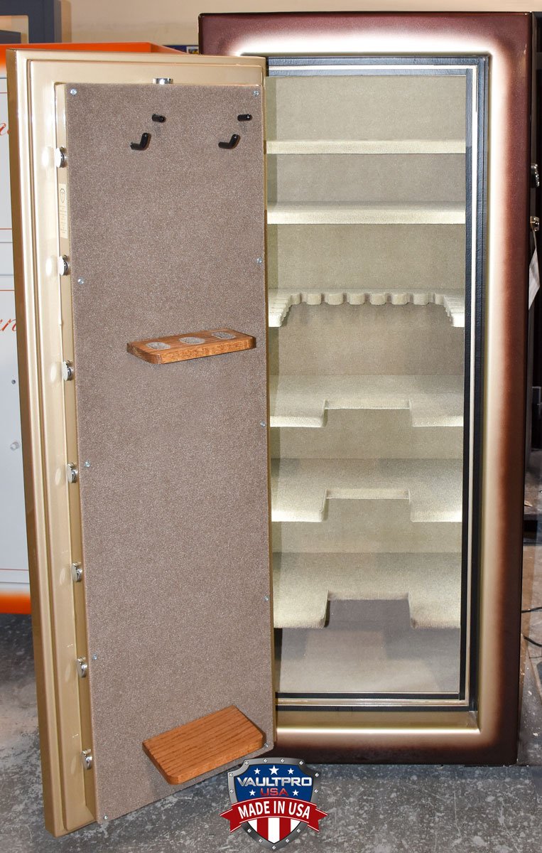Custom safe interior with pistol pegs on back of door and custom long gun door rack. Shelves are notched to allow door to close securely with guns on storage rack.