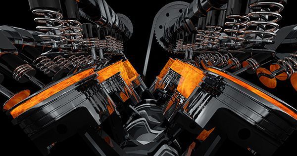 An animated V8 engine with orange lit cylinders, metallic parts, and a black background. | Auto Clinic Care