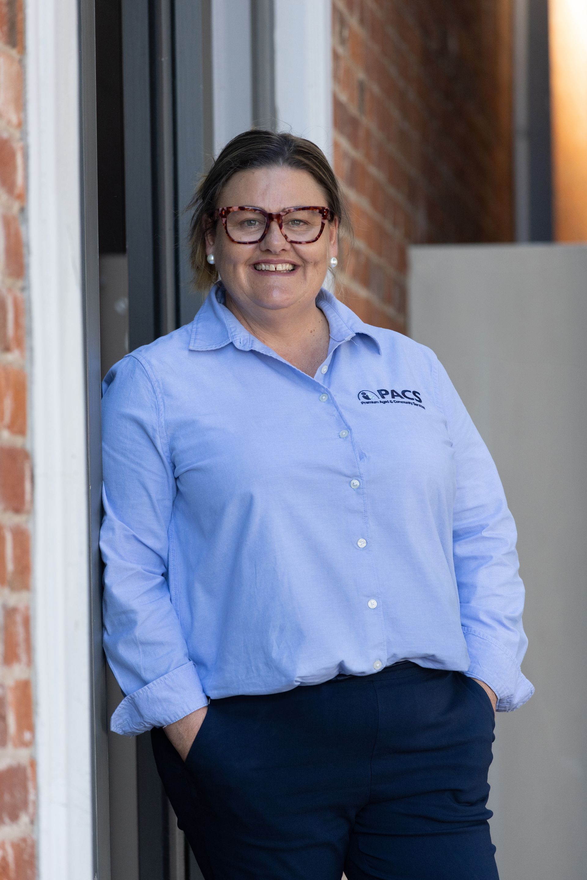 Woman in Blue Button-down Shirt and Navy Pants — Premium Aged & Community Services In Tamworth, NSW