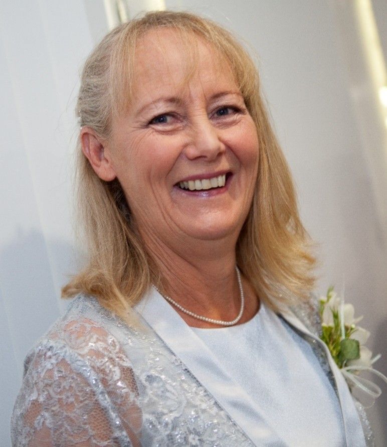 Woman With Blonde Hair, Smiling, Wearing a Light Blue Dress — Premium Aged & Community Services In Tamworth, NSW