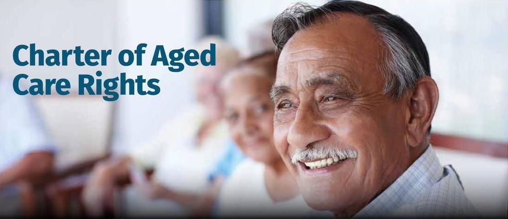 A Smiling Senior Citizen With a Mustache, Alongside Other Seniors — Premium Aged & Community Services In Tamworth, NSW