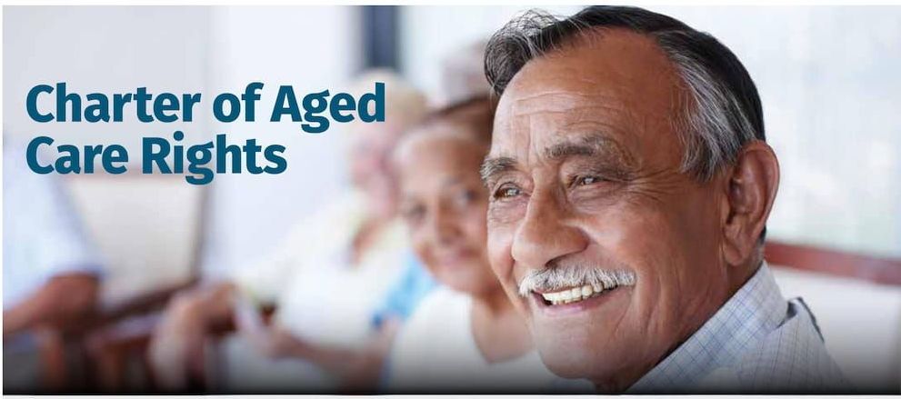 Smiling Older Man With Others in the Background — Premium Aged & Community Services In Tamworth, NSW