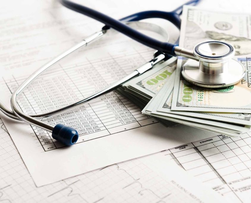 Dollars with stethoscope on them. Costs for the medical insurance Dollars with stethoscope on them. Costs for the medical insurance