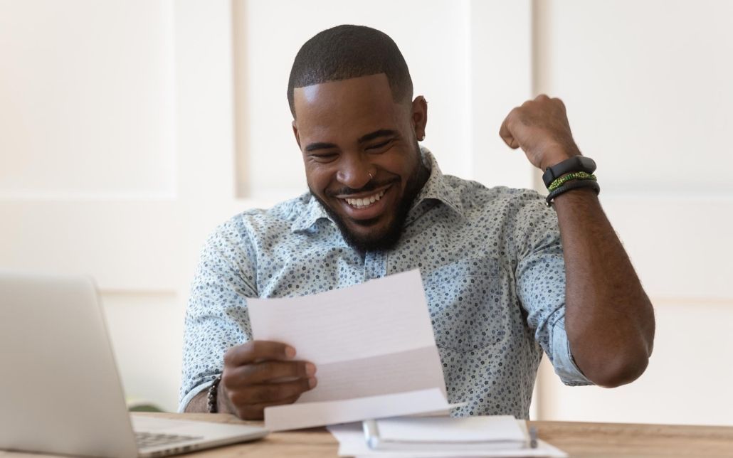 Image of a person excited over their loan approval. Image of a person excited over their loan approval.