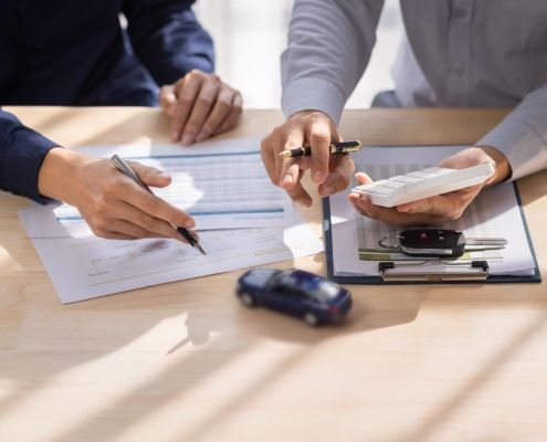 Image of two business people reviewing paperwork. Image of two business people reviewing paperwork.