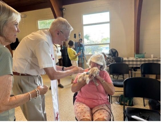 A man is talking to a woman in a wheelchair