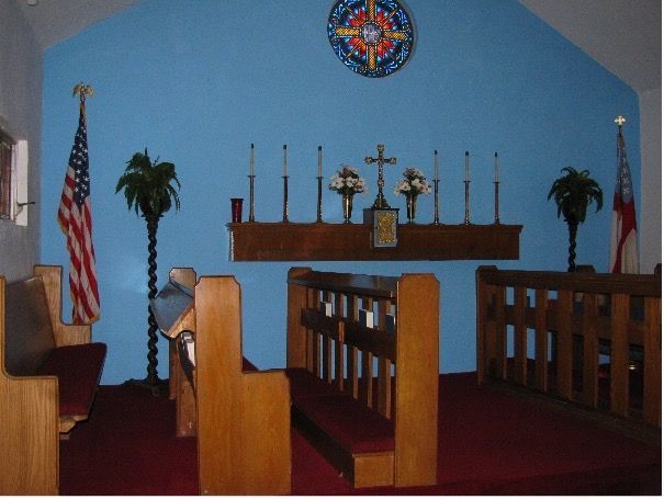 The inside of a church with a blue wall