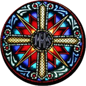 A stained glass window with a cross in the center