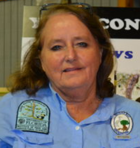 A woman wearing a blue shirt with a patch that says florida on it