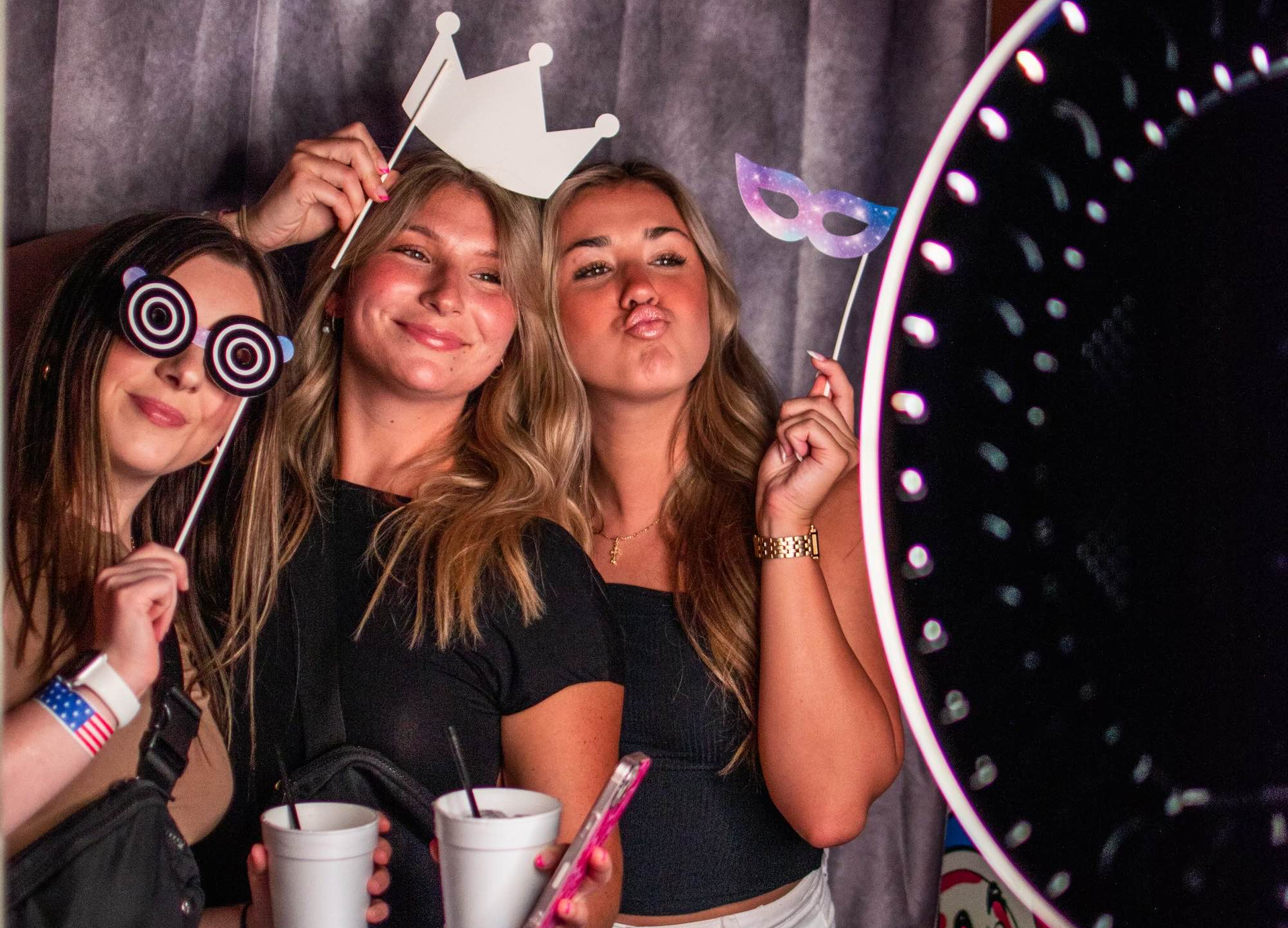 women taking a picture at a photo booth in baton rouge Louisiana 