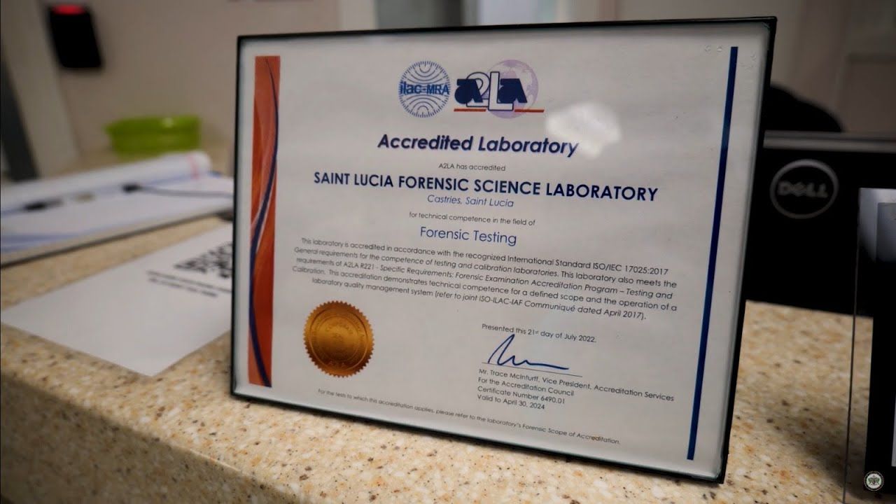 An accredited laboratory certificate is on a counter