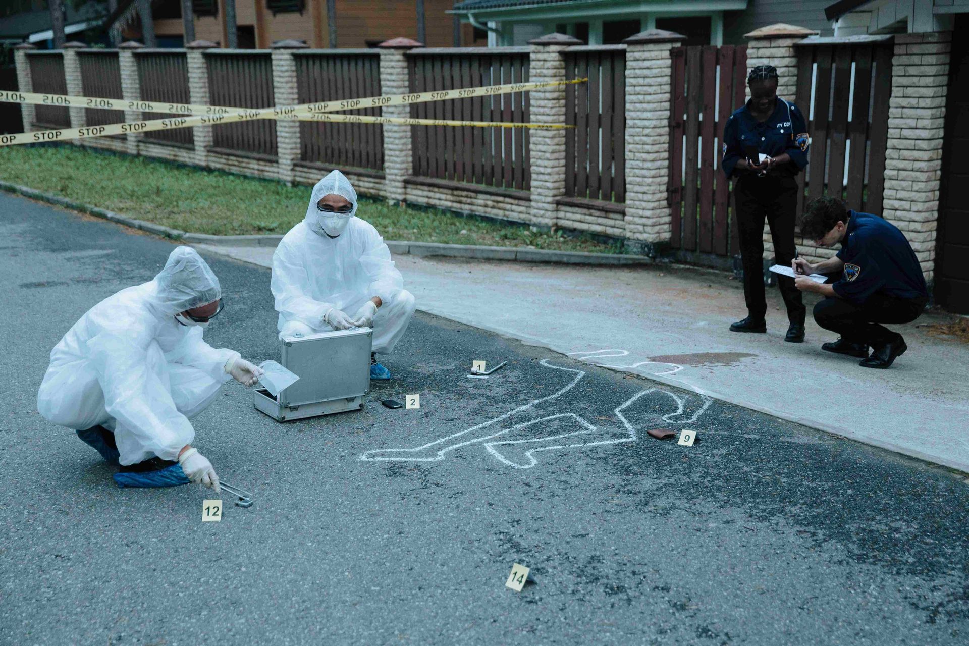 A group of forensic experts are working on a crime scene.