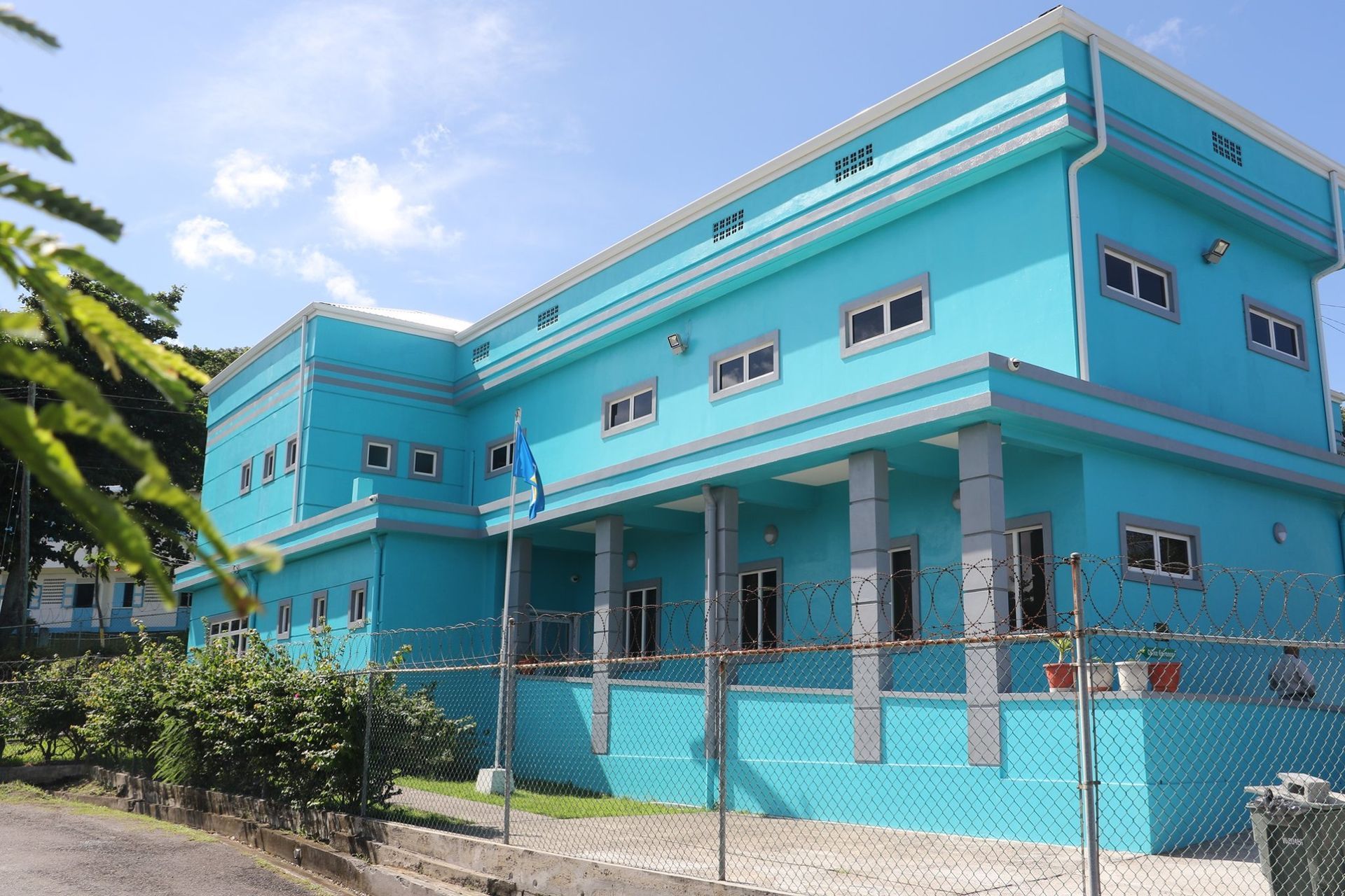 A large blue building with a lot of windows
