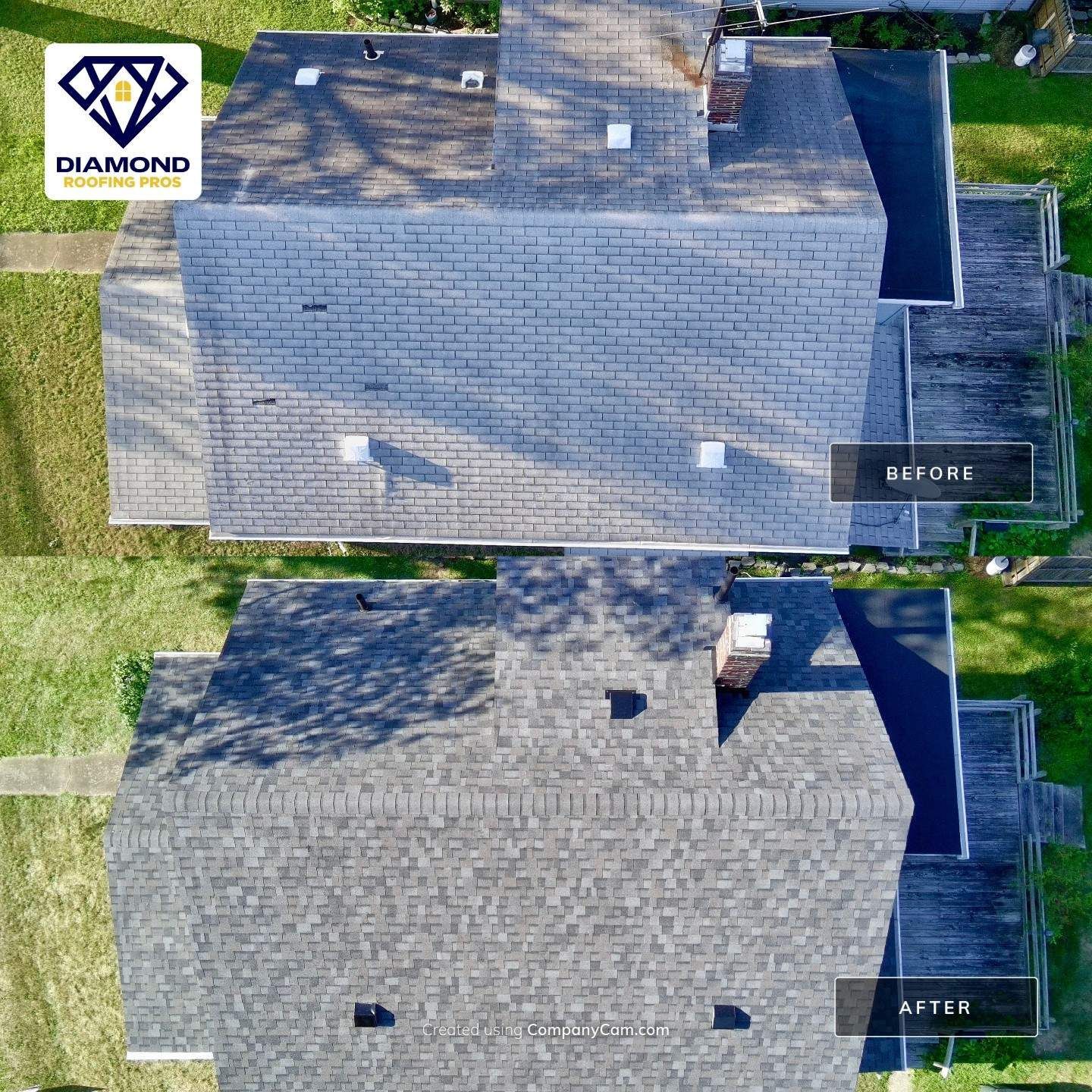 Top-down aerial view of a gray shingled roof with skylights, chimneys, and surrounding green lawn.