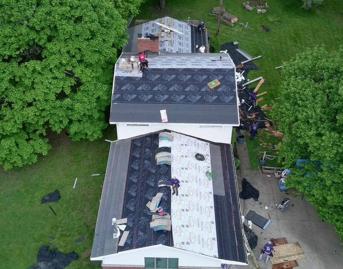 Aerial view of a home in Solon with its roof being replaced