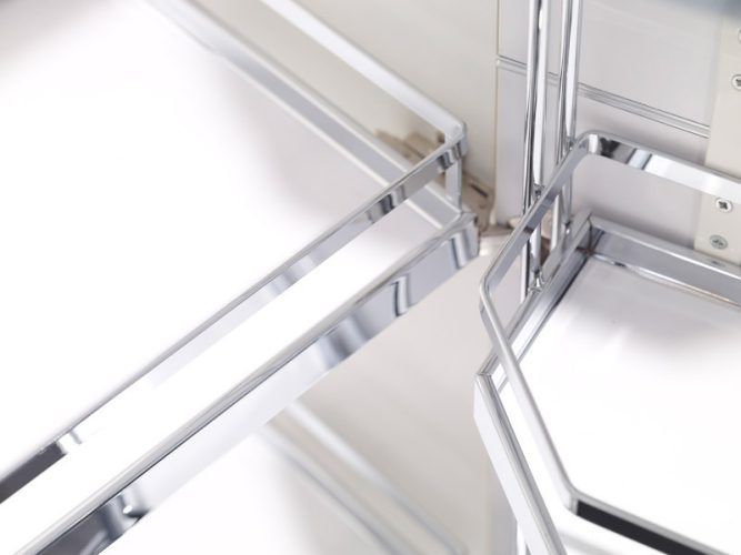 Chrome-framed kitchen cabinet corner with pull-out shelves; white interiors.