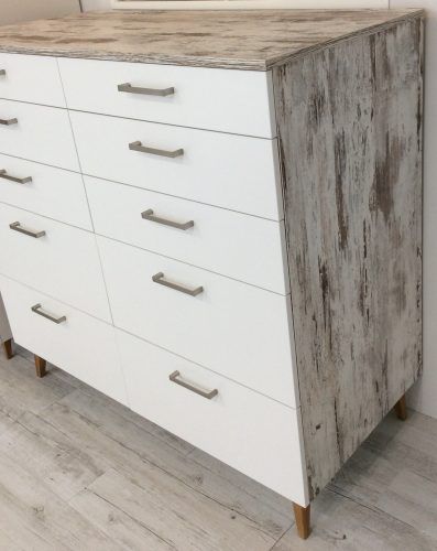 White dresser with gray, distressed wood side.