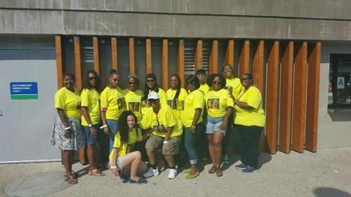 group volunteers in a yellow shirts