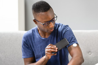 patient using a glucose monitor