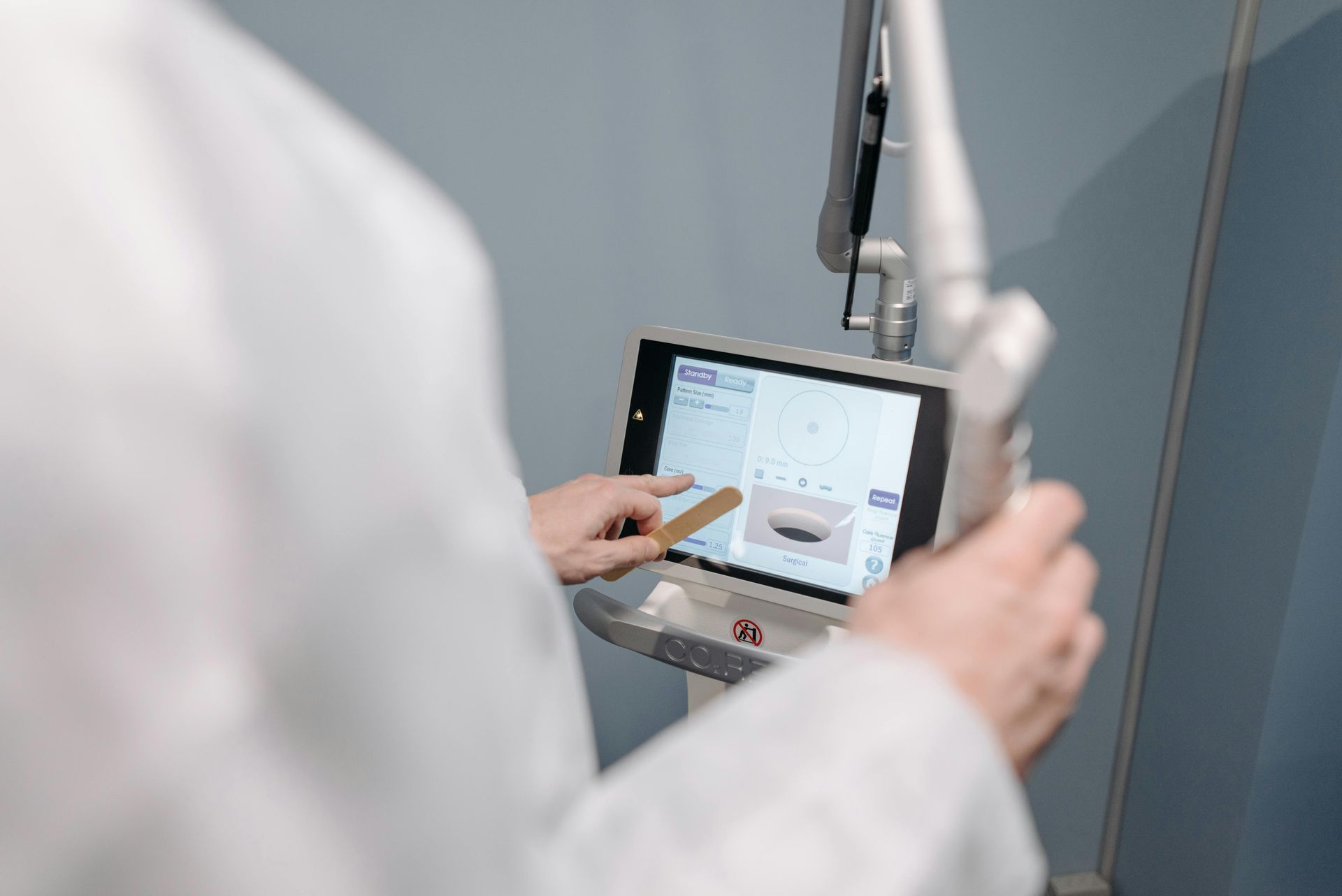 clinician using a medical device user interface