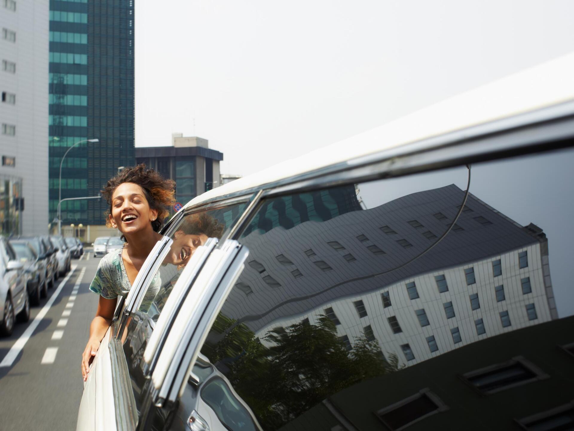woman riding a limousine