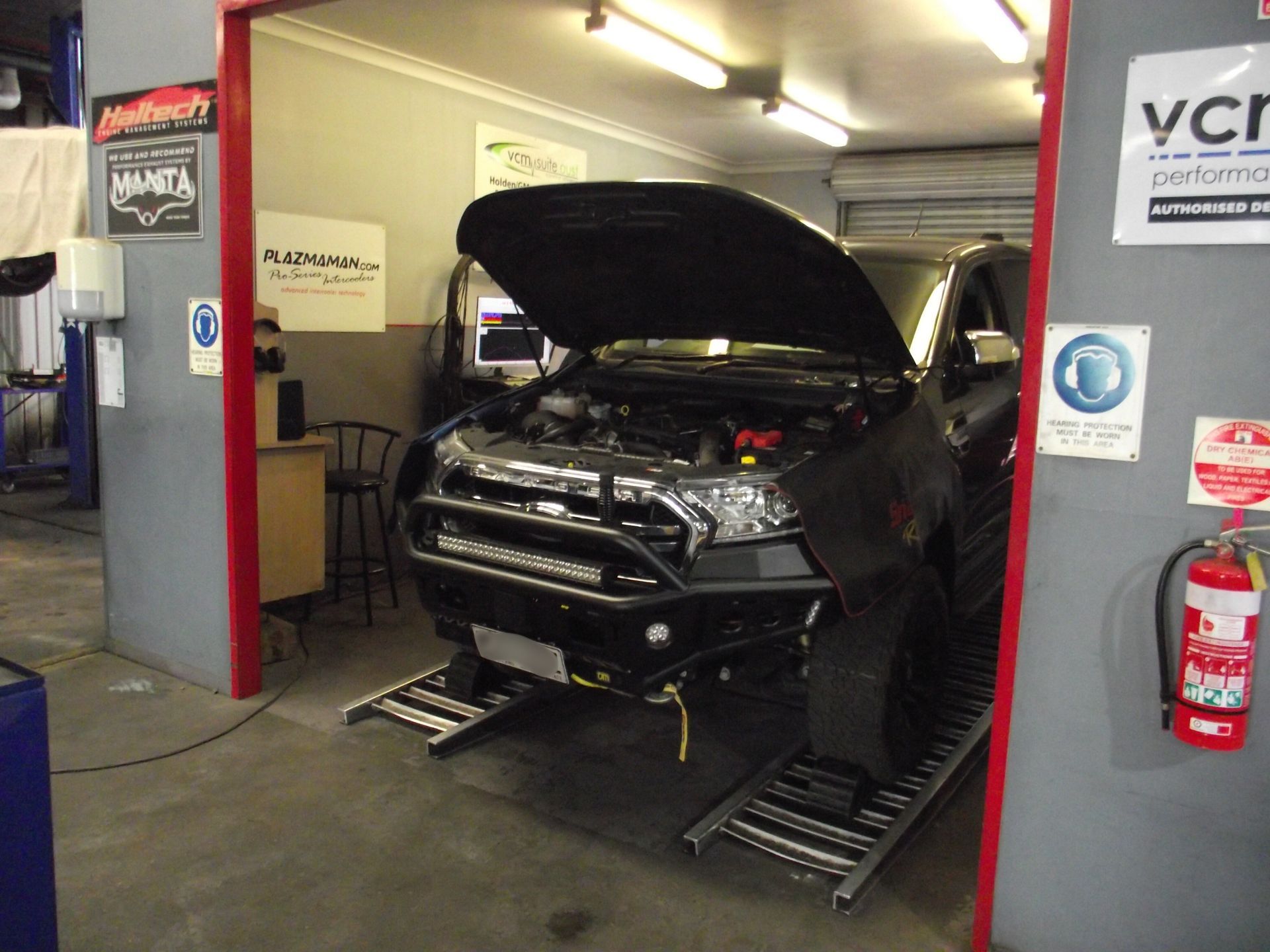 A Close Up of a Car Engine With the Hood Open — Aitkenvale Auto & Dyno in Aitkenvale, QLD