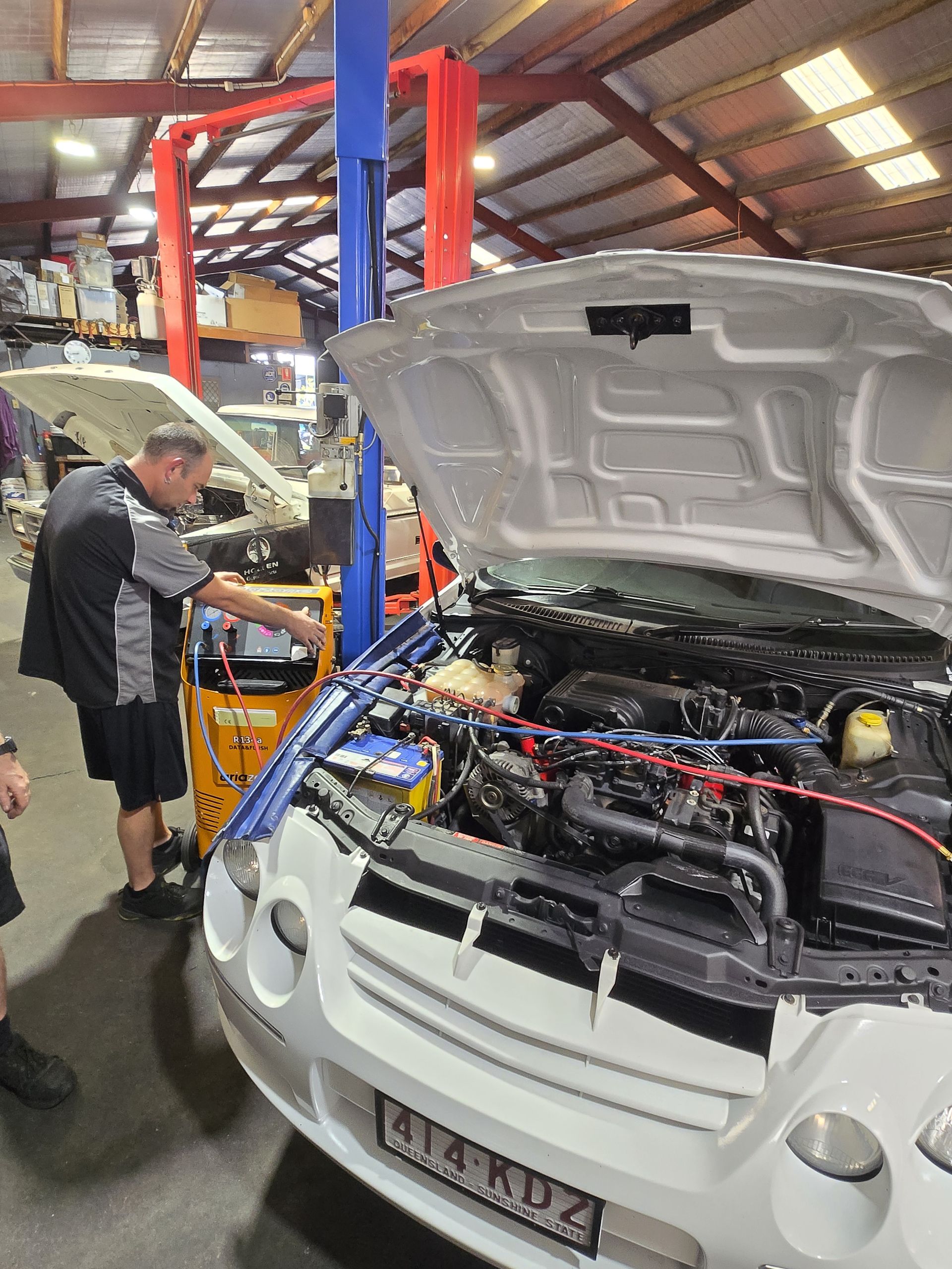 The Engine of a Blue Car is Shown With the Hood Open — Aitkenvale Auto & Dyno in Aitkenvale, QLD